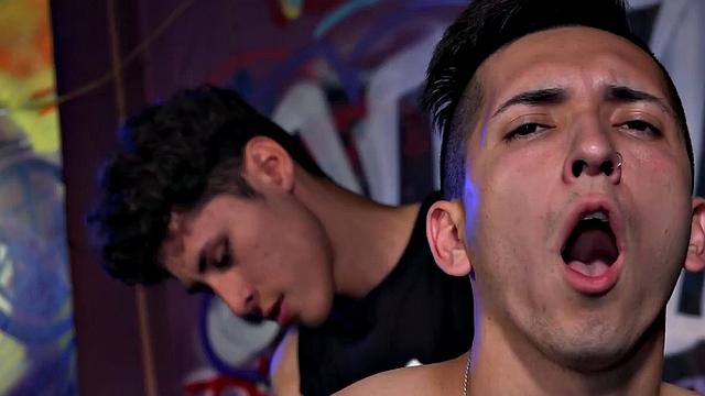 The club is empty and Latinos Dimitri and Ethan find themselves alone and horny. Ethan drops his pants and bends over for some butt slapping, and hole fingering, before Dimitri pulls out his big cock and feeds it to him.