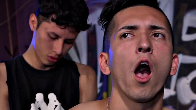 The club is empty and Latinos Dimitri and Ethan find themselves alone and horny. Ethan drops his pants and bends over for some butt slapping, and hole fingering, before Dimitri pulls out his big cock and feeds it to him.