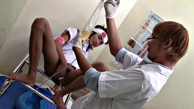 Pissing Asian twink enjoys bareback sex with doctor