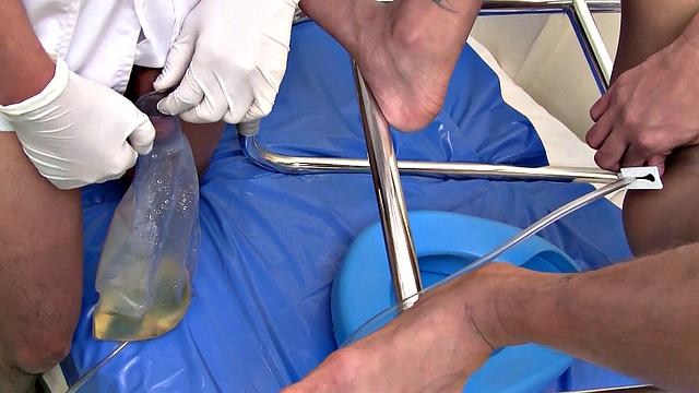 Pissing Asian twink enjoys bareback sex with doctor