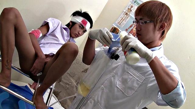 Pissing Asian twink enjoys bareback sex with doctor