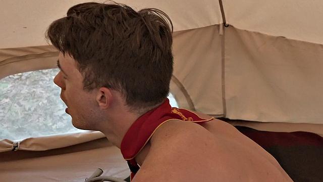 Inked gaydaddy fucks bottom twink in tent outdoor