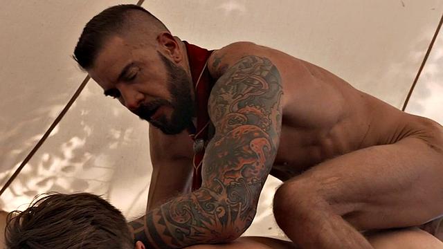 Inked gaydaddy fucks bottom twink in tent outdoor