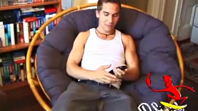 Brocks pops in a porn video and starts to strip. The man sports a hard cock, stroking it before exploding on his face and chest.