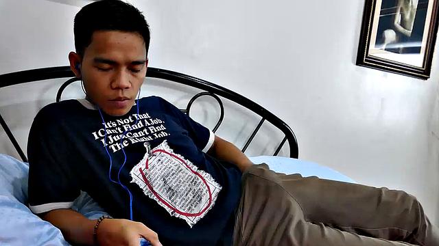 This boy next door type of Asian twink tries to not jerk off so much by listening to some tunes. But he's got such an obsession with male feet fetish, nothing can keep his mind off of it.