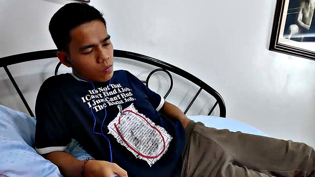 This boy next door type of Asian twink tries to not jerk off so much by listening to some tunes. But he's got such an obsession with male feet fetish, nothing can keep his mind off of it.