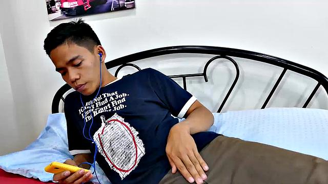 This boy next door type of Asian twink tries to not jerk off so much by listening to some tunes. But he's got such an obsession with male feet fetish, nothing can keep his mind off of it.