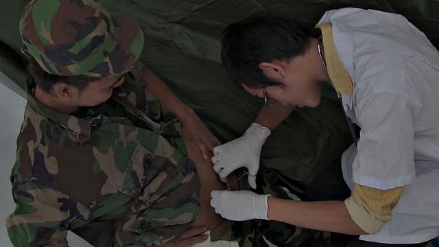 Asian doctor fucks soldier's asshole after sucking his cock