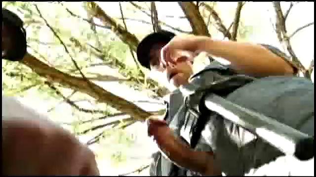 Security guards, Tommy Lima and Alfonso Rosas, are looking for fun when they discover Israel Amezquita. Standing and rubbing their intentions are clear as they pull Israel out behind the building.