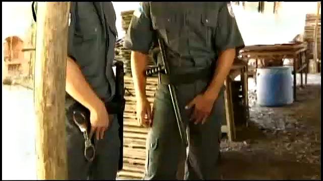 Security guards, Tommy Lima and Alfonso Rosas, are looking for fun when they discover Israel Amezquita. Standing and rubbing their intentions are clear as they pull Israel out behind the building.