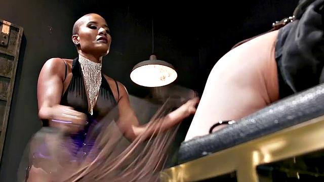 Nubian domina whips blindfolded sub in BDSM pleasure