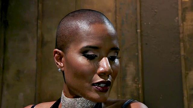 Nubian domina whips blindfolded sub in BDSM pleasure