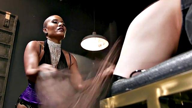 Nubian domina whips blindfolded sub in BDSM pleasure