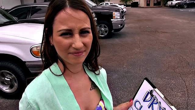 Get off with this hot, bald babe in the car and enjoy her small tits and topless outdoor masturbation fantasies