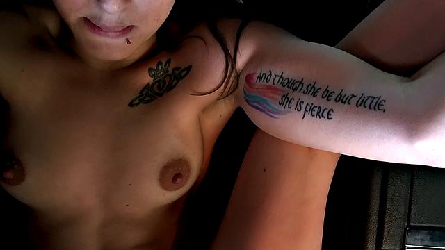 Get off with this hot, bald babe in the car and enjoy her small tits and topless outdoor masturbation fantasies