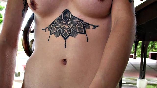 Watch this tattooed babe tease and jerk off her small ass with her big tits out