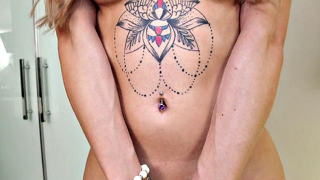 A big-titted babe pleasure herself with finger and booty play in the bedroom