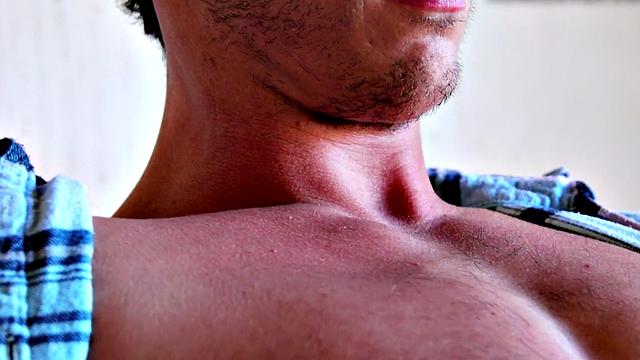 Shaved hunk shoots cum after jerking on farm