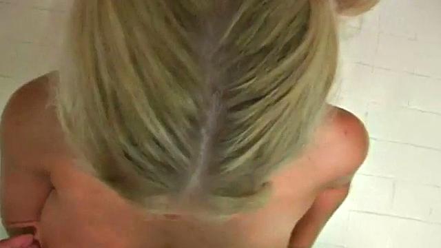 Busty blonde teen gives a handjob