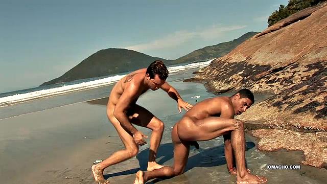While visiting a beautiful island, horny Latinos Alber and Antony find a big flat rock, next to the crashing waves, to fuck. Once naked, Alber sucks his top's cock until it's hard and then hops on for a raw ride.