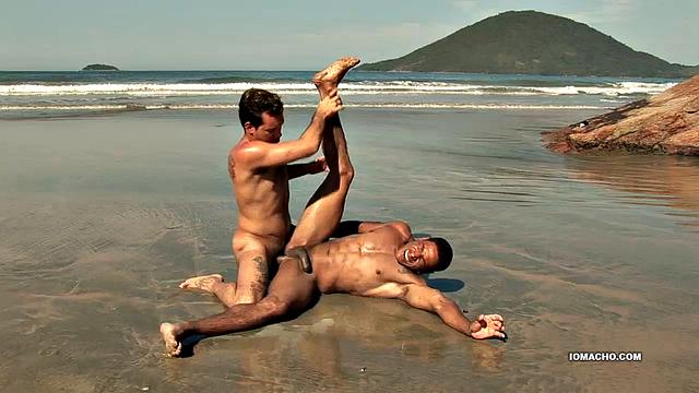 While visiting a beautiful island, horny Latinos Alber and Antony find a big flat rock, next to the crashing waves, to fuck. Once naked, Alber sucks his top's cock until it's hard and then hops on for a raw ride.