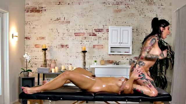 Oiled-up MILF with big tits and tattoos gets her face and pussy licked by teen masseuse