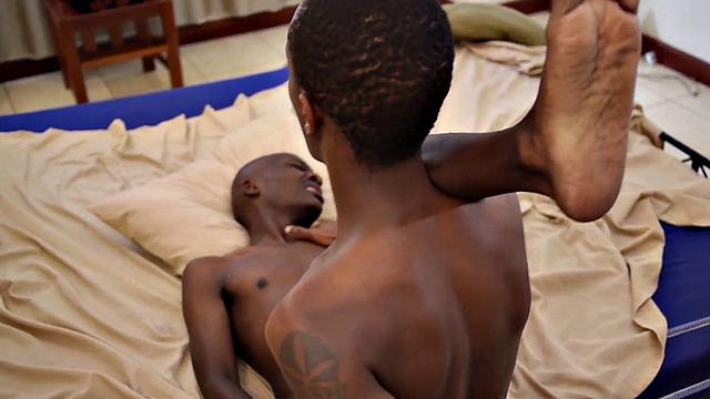 Bald African skinny twink barebacked by cock at home