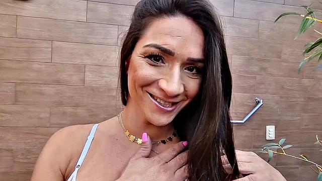 A curvy young tgirl tease and please herself in lingerie and high heels