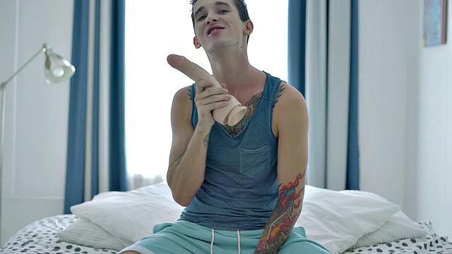 Inked twink enjoys solo anal play with dildo and gets wild with dildos in the bedroom