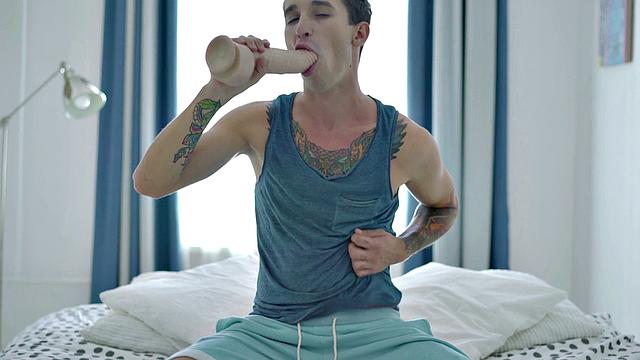 Inked twink enjoys solo anal play with dildo and gets wild with dildos in the bedroom