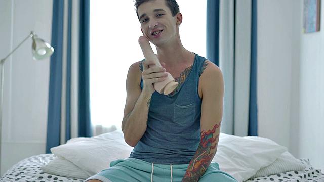 Inked twink enjoys solo anal play with dildo and gets wild with dildos in the bedroom