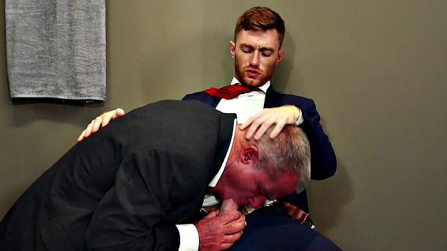 Muscled gray DILF fisting inked otter after blowjob