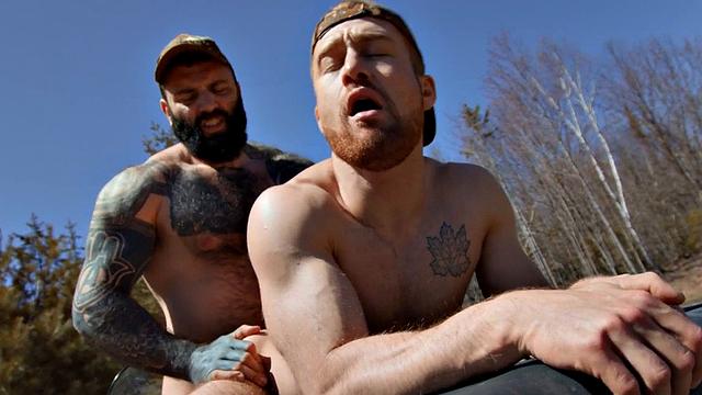 Bearded gay fucks jock in forest on quad