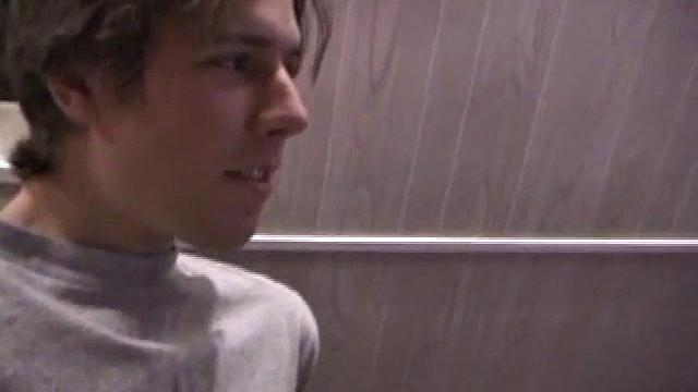 He shoots his load against the glass while another guy watches, thick cum splattering everywhere