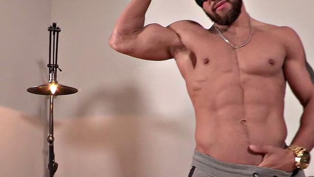 Tattooed masked stud jerks and cums after casting