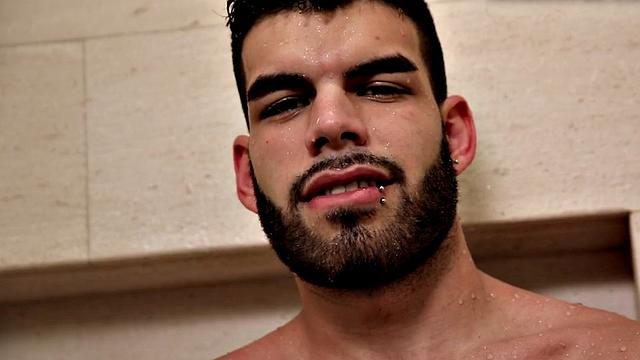 Bearded jock masturbates in close-up action after shower