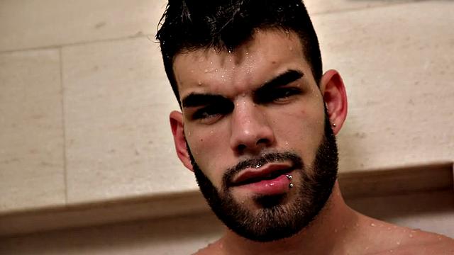 Bearded jock masturbates in close-up action after shower