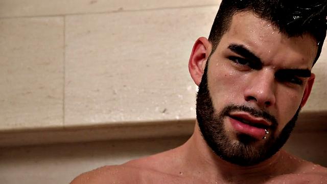 Bearded jock masturbates in close-up action after shower