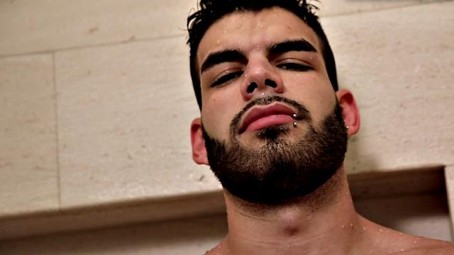 Bearded jock masturbates in close-up action after shower