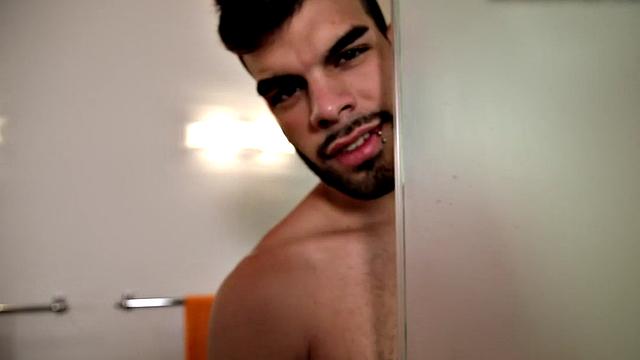 Bearded jock masturbates in close-up action after shower