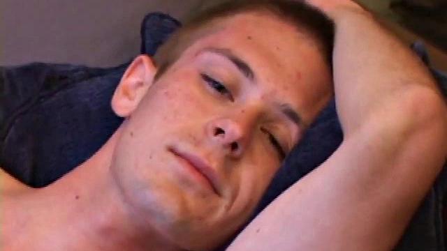 Tommy Nolan quickly strips naked and begins pulling on his dick, while watching a porn video. He works up a nice stiff one and then shows us his pretty ass. Then he gets down to business, stroking his hard cock.