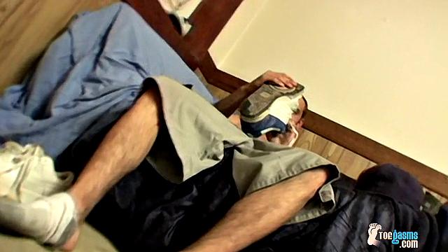 Ajax strokes his cock and shows off his foot obsession