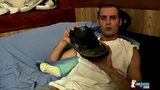 Ajax strokes his cock and shows off his foot obsession