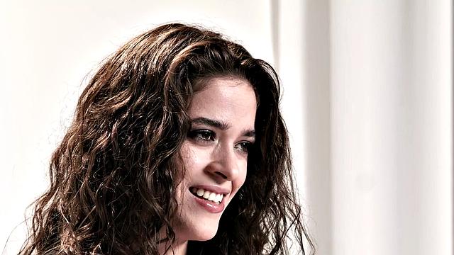 Cute babe teasing with vibrator