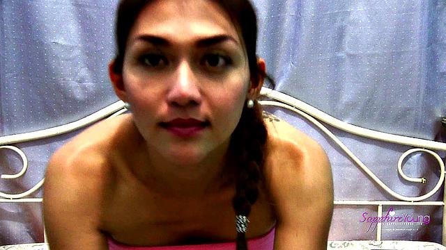 Sapphire Young strokes on her bed