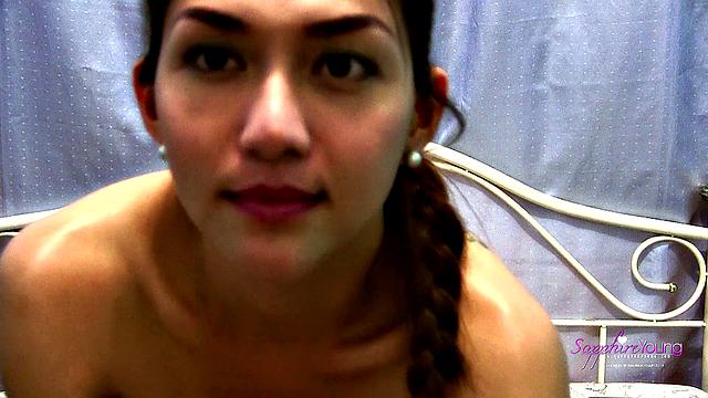 Sapphire Young strokes on her bed