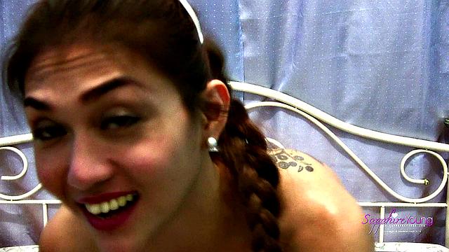 Sapphire Young strokes on her bed
