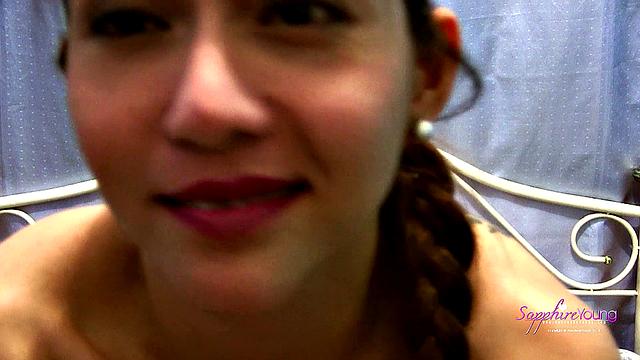 Sapphire Young strokes on her bed