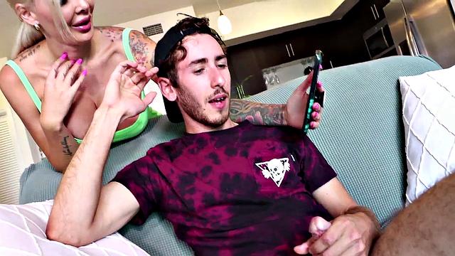 Femdom bosomy tattooed MILF jerks off her fav stud