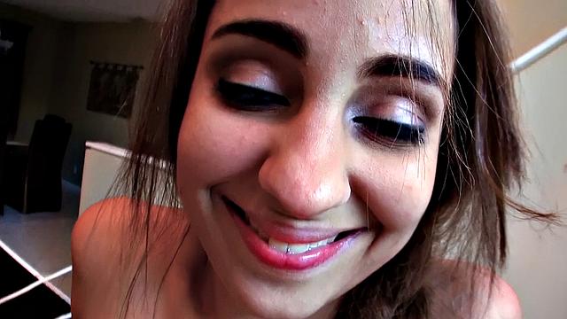 Amateur brunette with small tits sucks balls at the table and gets a pierced pussy